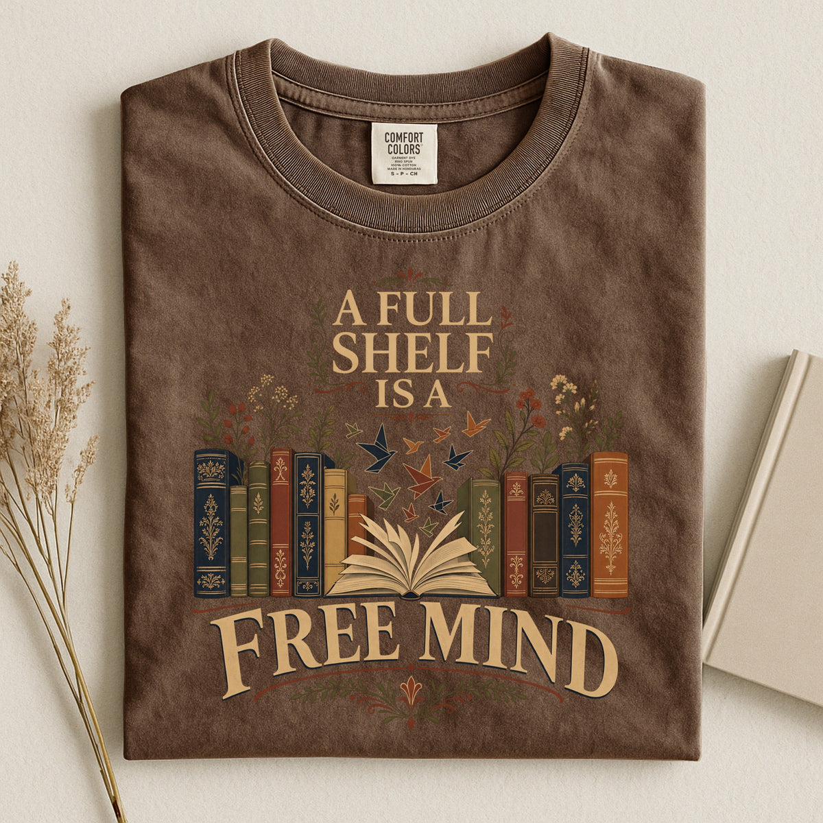 A Full Shelf Is a Free Mind bookish tee in Espresso, flat lay