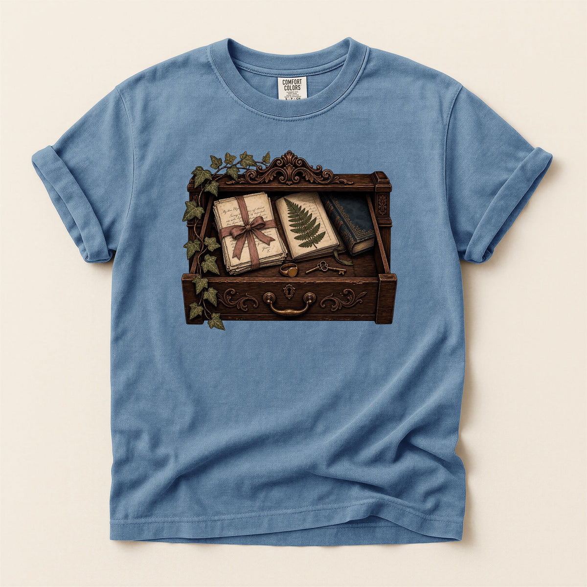 Reader's Keepsake Drawer bookish tee in Blue Jean, full flat