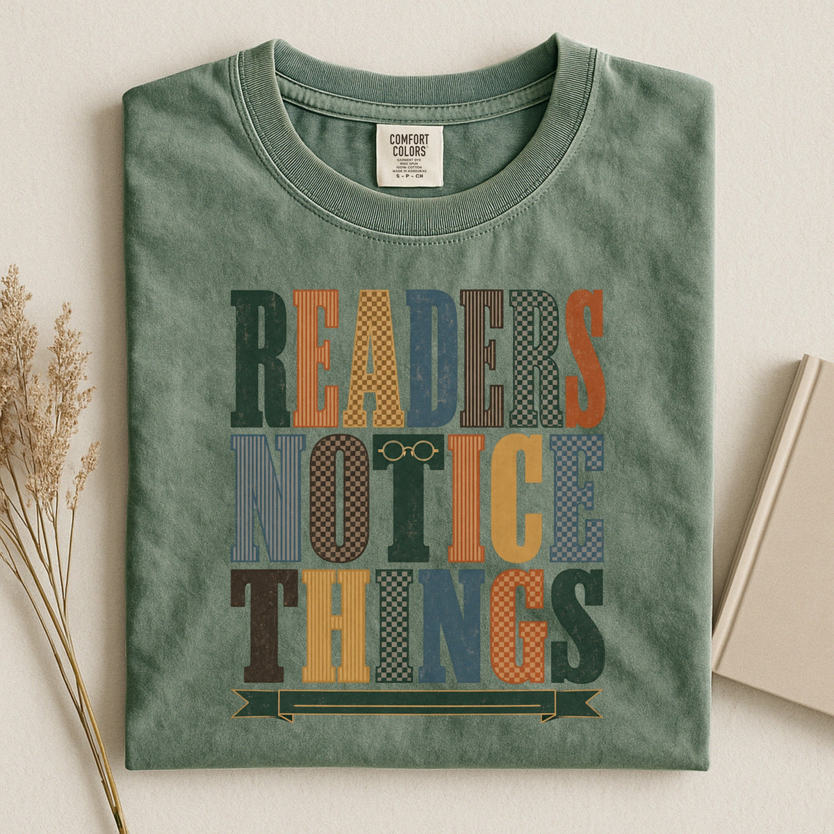 Readers Notice Things bookish tee in Moss, flat lay