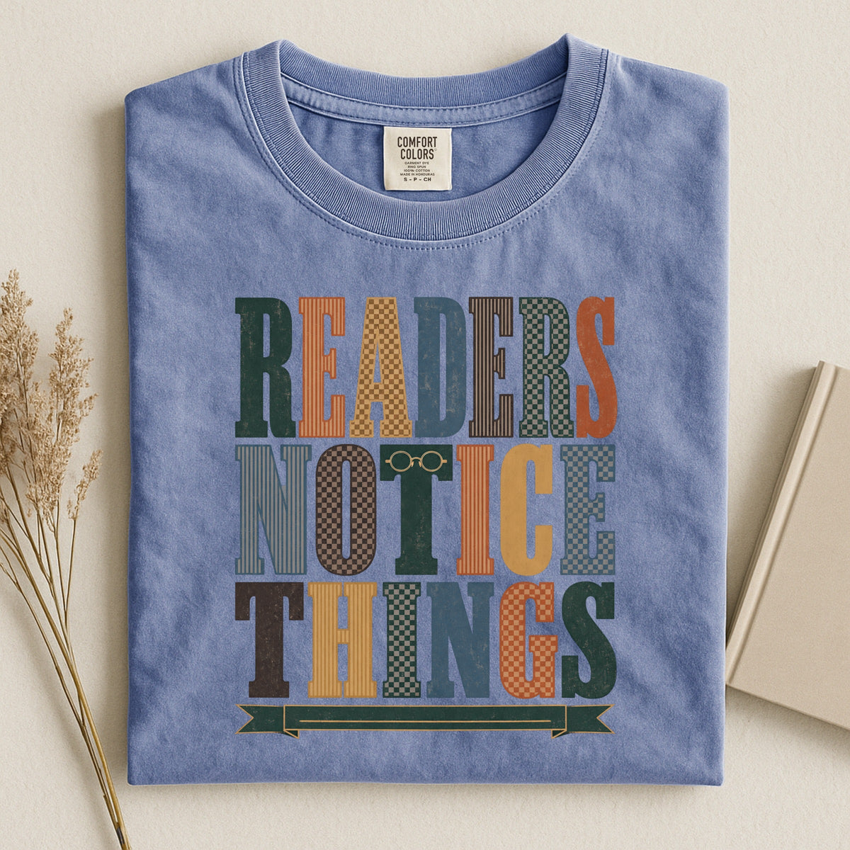Readers Notice Things bookish tee in Blue Jean, flat lay