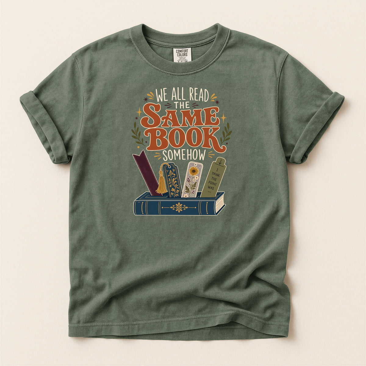 We All Read the Same Book Somehow bookish tee in Moss, full flat