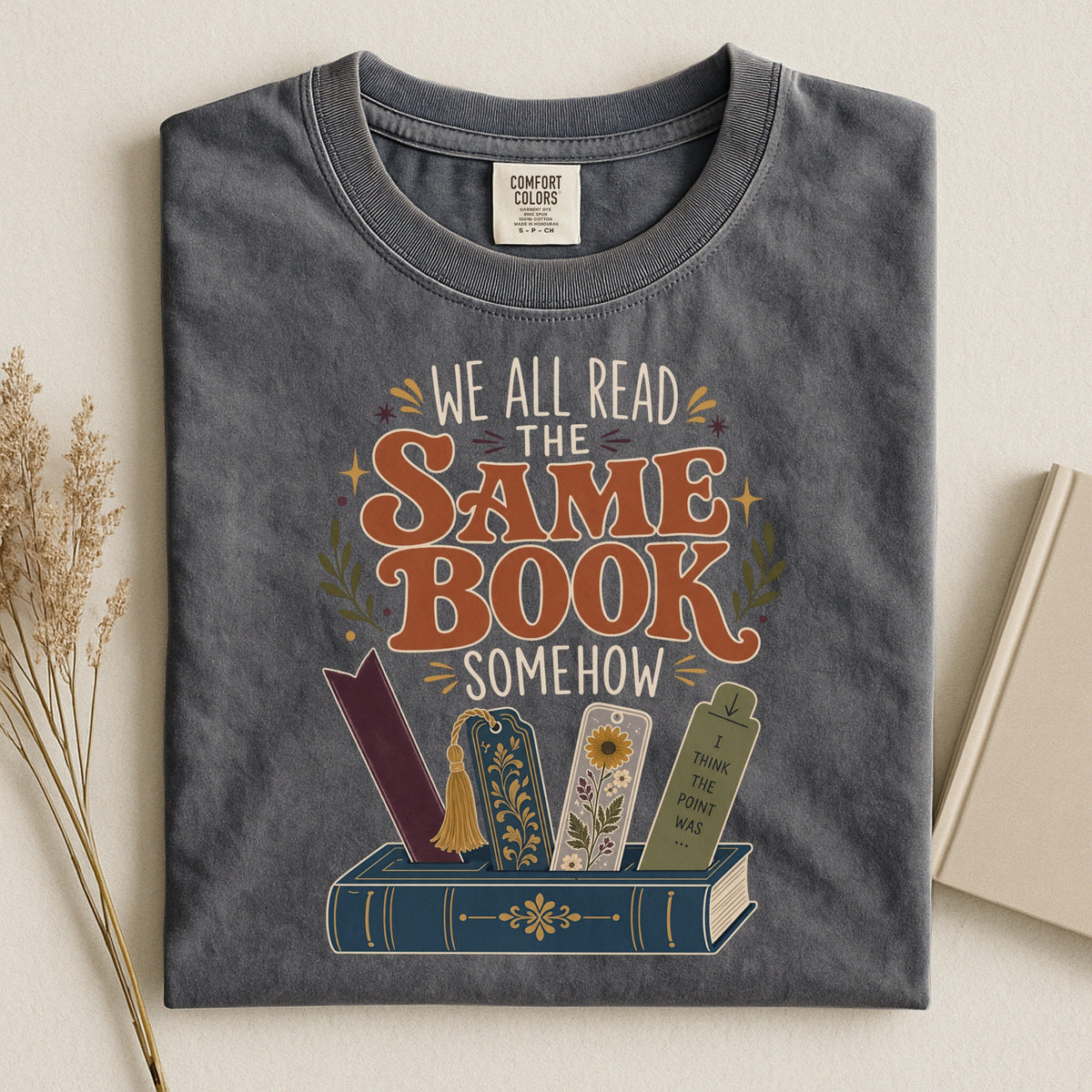 We All Read the Same Book Somehow bookish tee in Pepper, flat lay