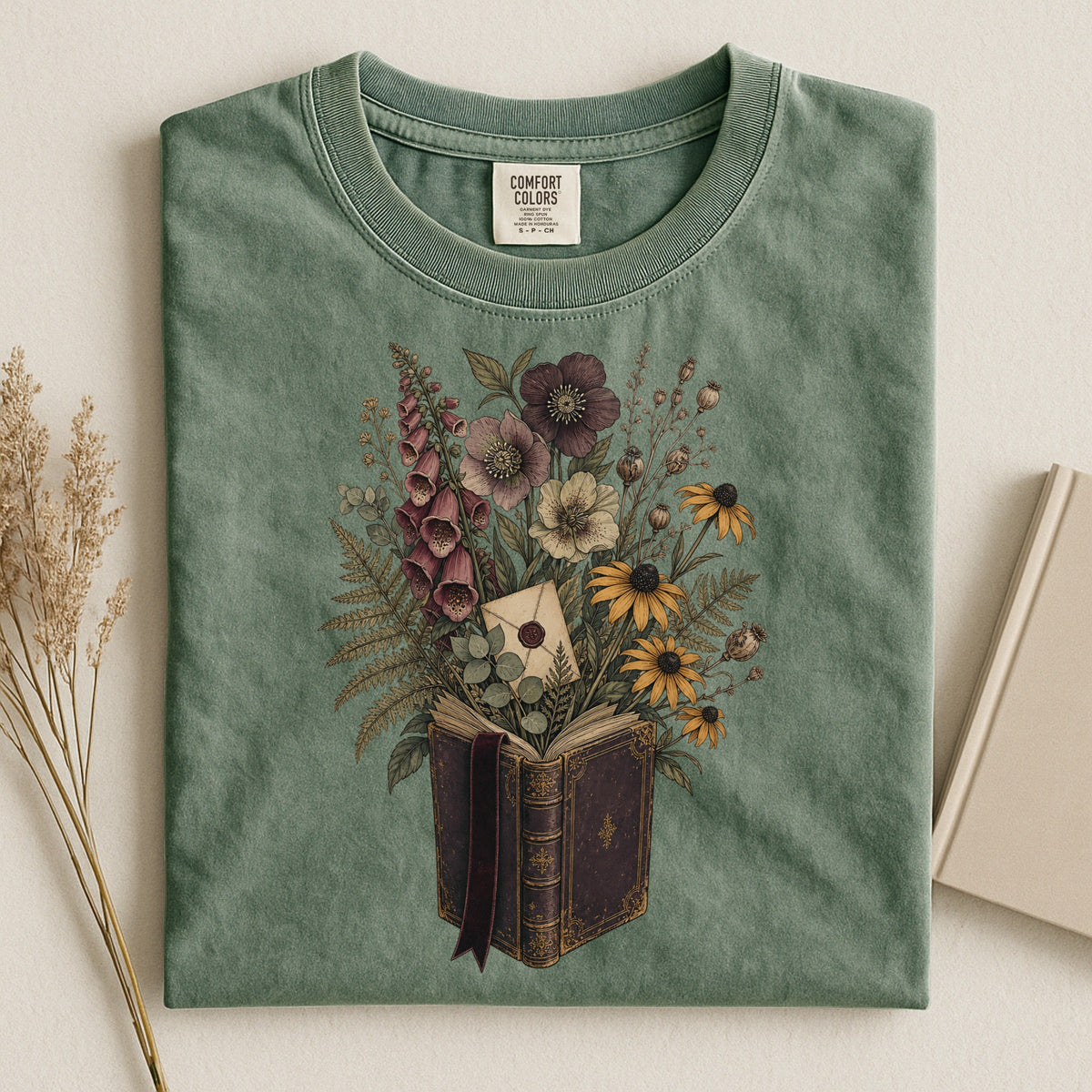 Wildflower Book Bouquet bookish tee in Moss, flat lay