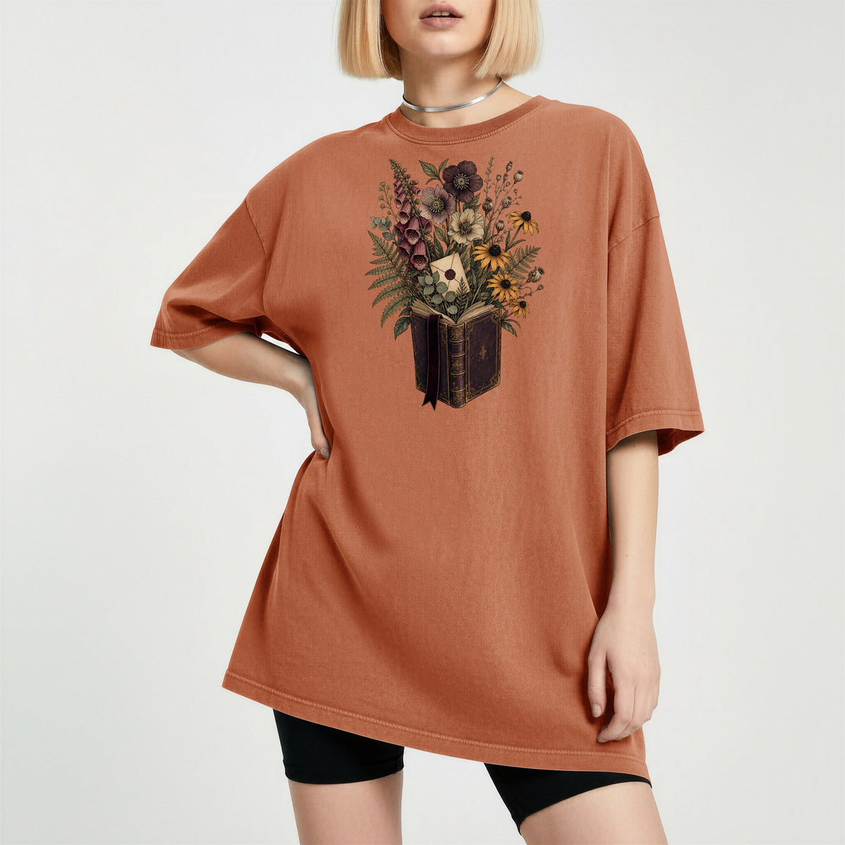 Wildflower Book Bouquet bookish tee in Yam, worn