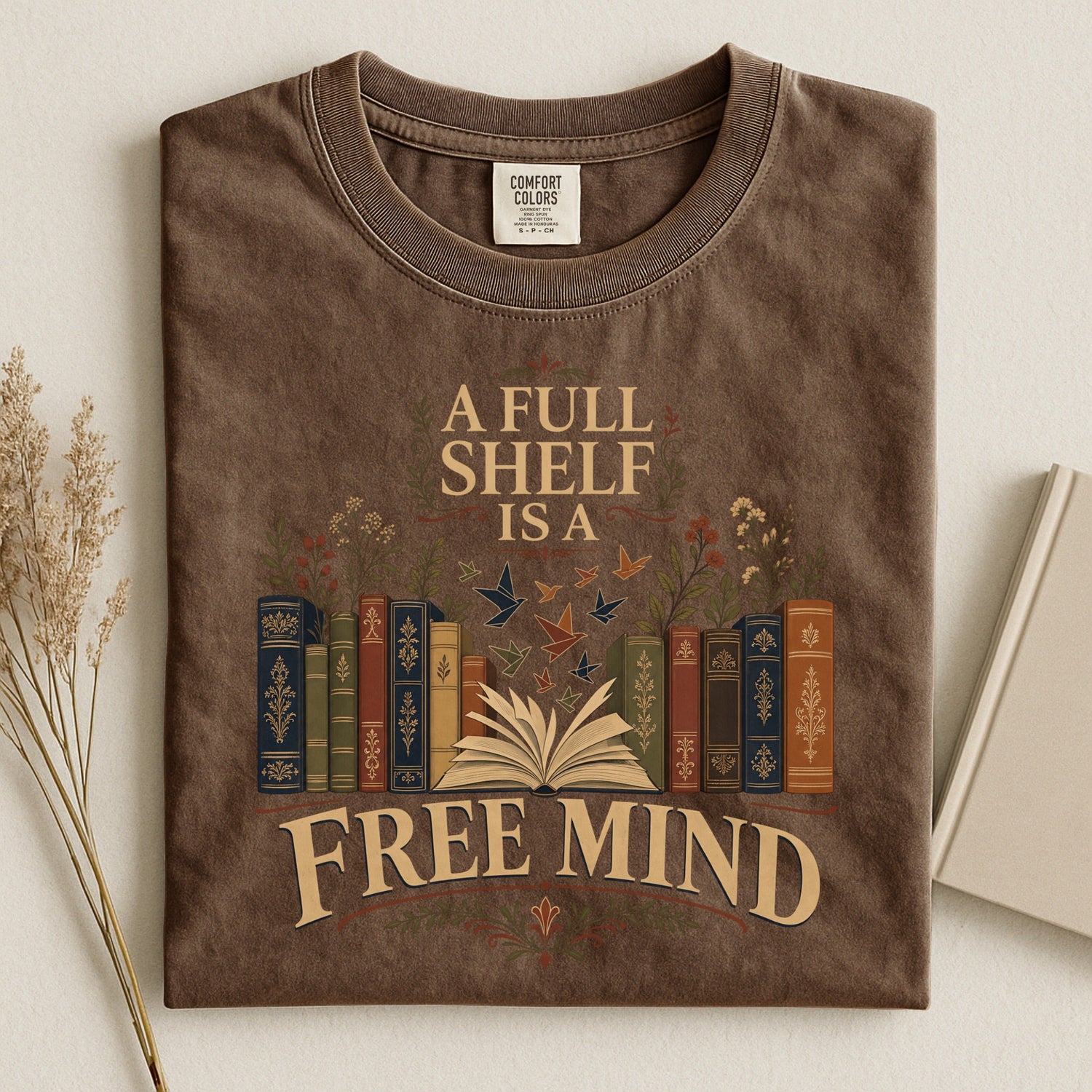 A Full Shelf Is a Free Mind bookish tee in Espresso, flat lay