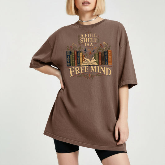 A Full Shelf Is a Free Mind bookish tee in Espresso, worn