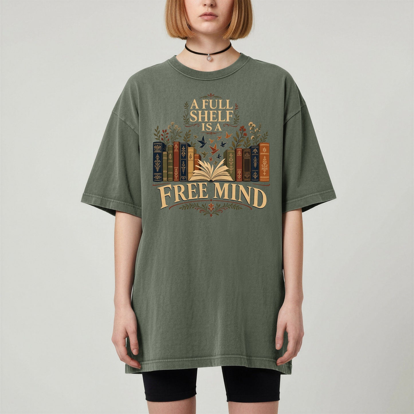 A Full Shelf Is a Free Mind bookish tee in Moss, worn