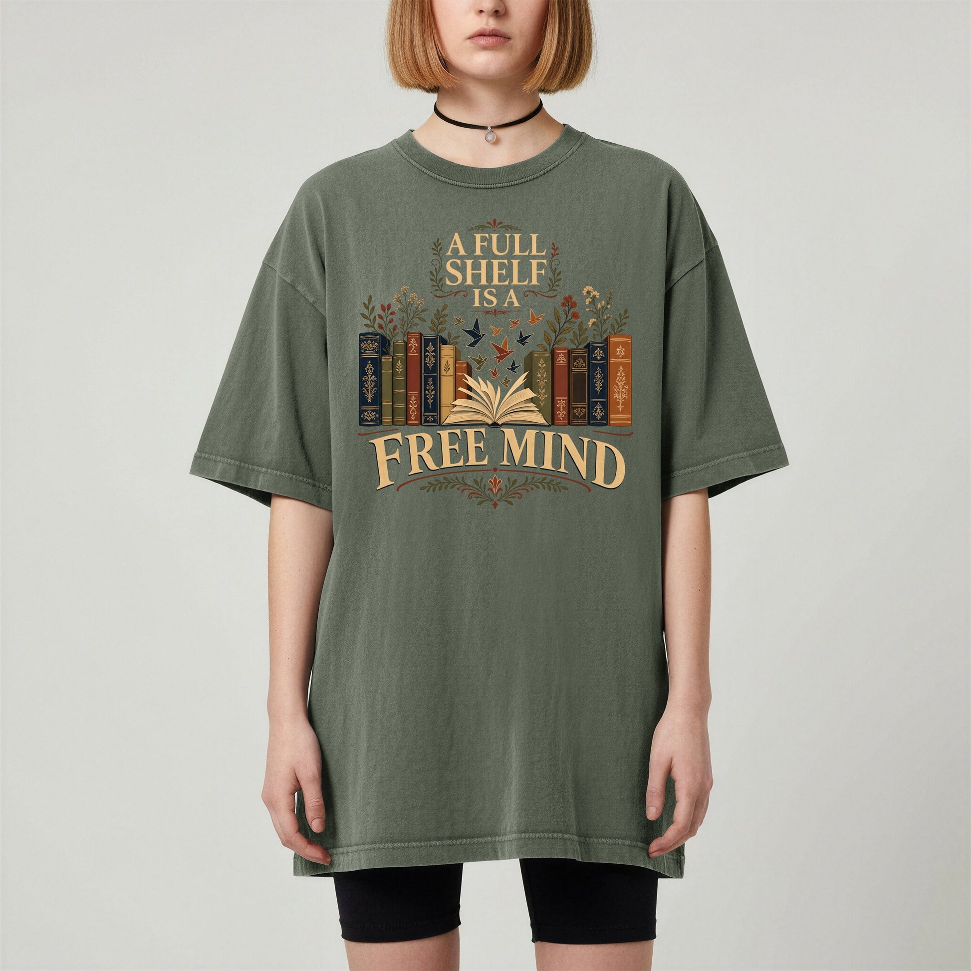 A Full Shelf Is a Free Mind bookish tee in Moss, worn