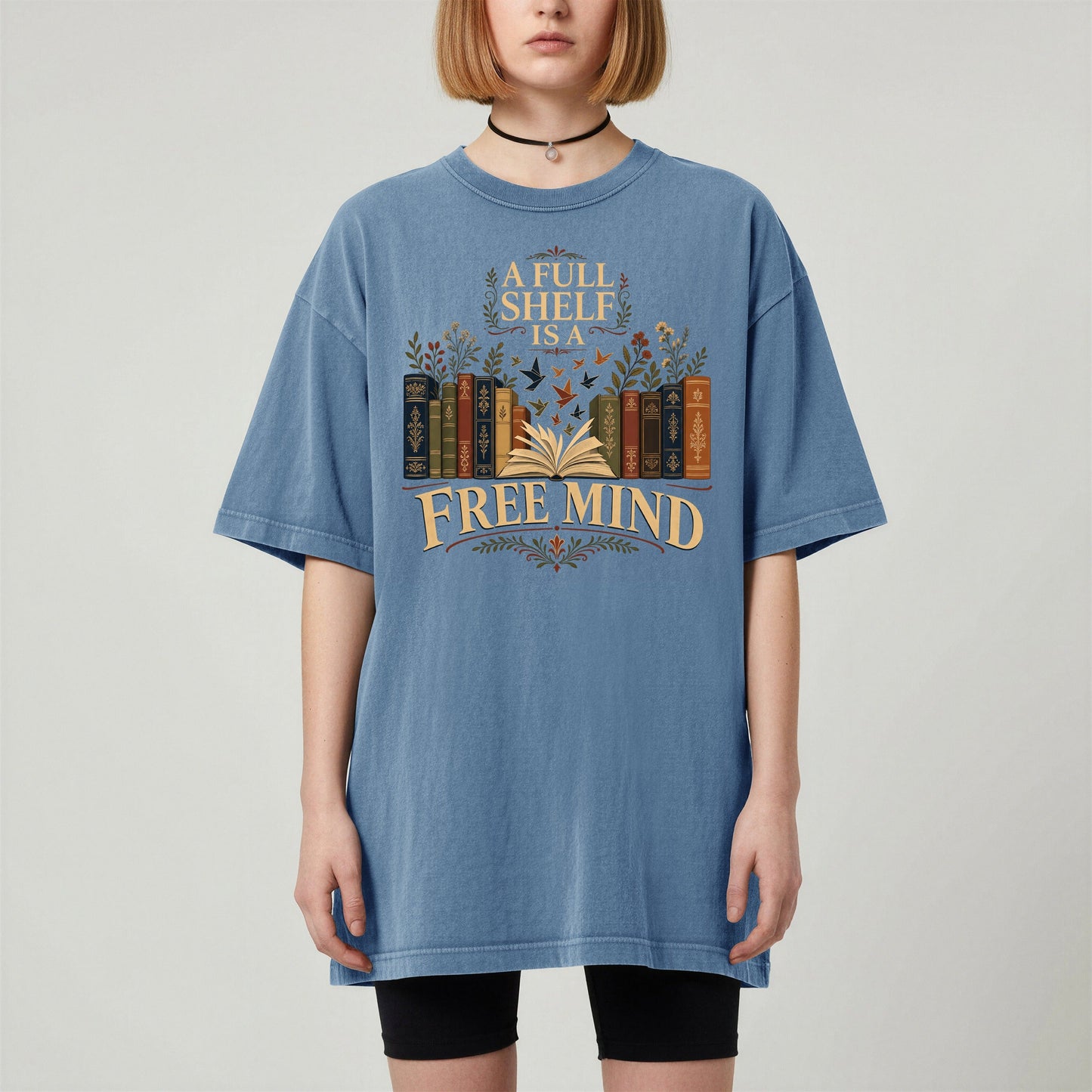 A Full Shelf Is a Free Mind bookish tee in Blue Jean, worn