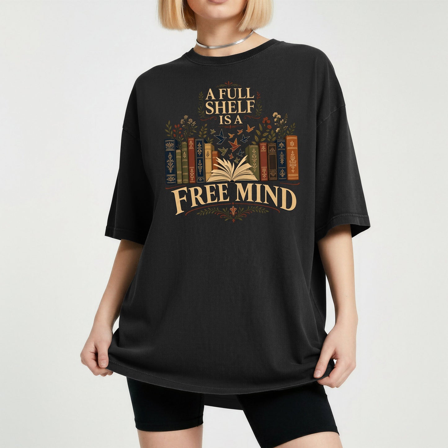 A Full Shelf Is a Free Mind bookish tee in Black, worn
