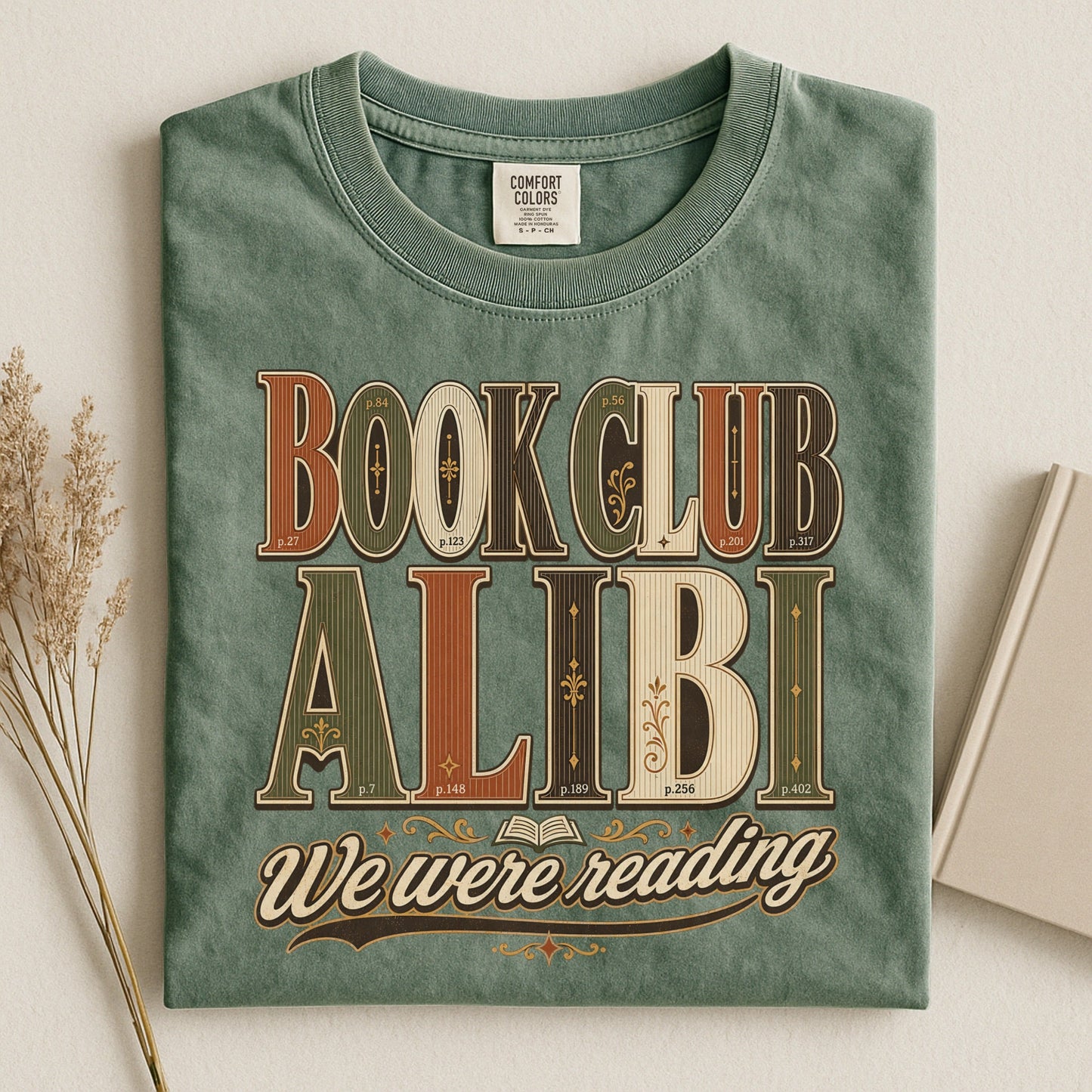 Book Club Alibi bookish tee in Moss, flat lay