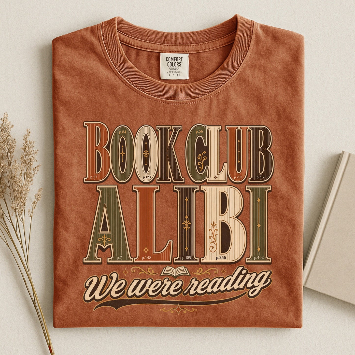 Book Club Alibi bookish tee in Yam, flat lay