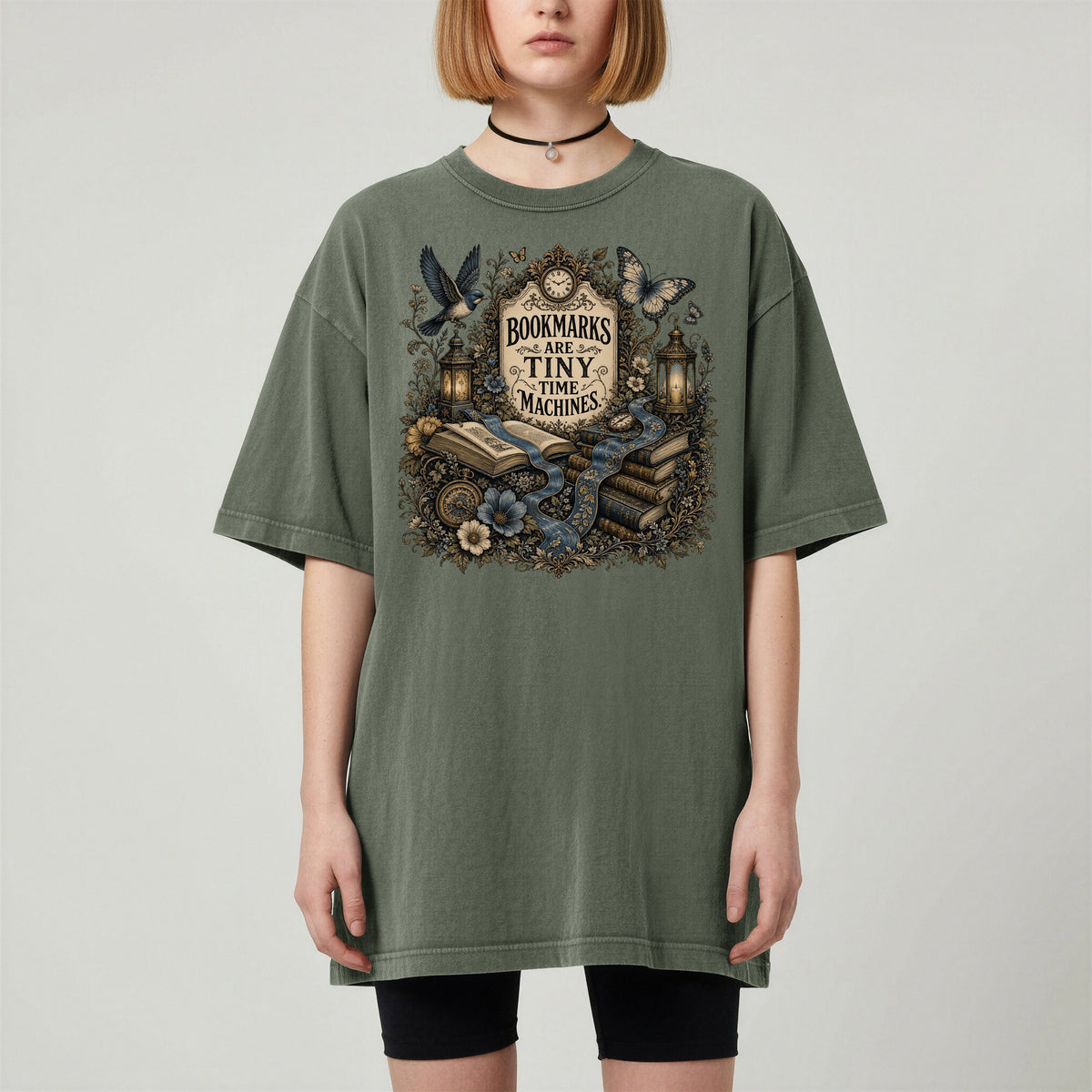 Bookmarks Are Tiny Time Machines bookish tee in Moss, worn