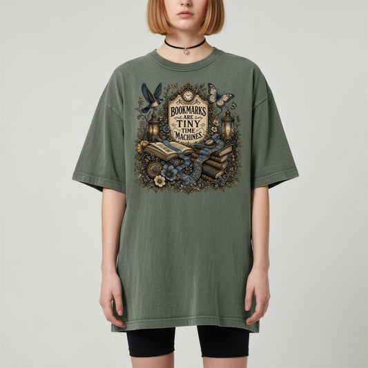 Bookmarks Are Tiny Time Machines bookish tee in Moss, worn