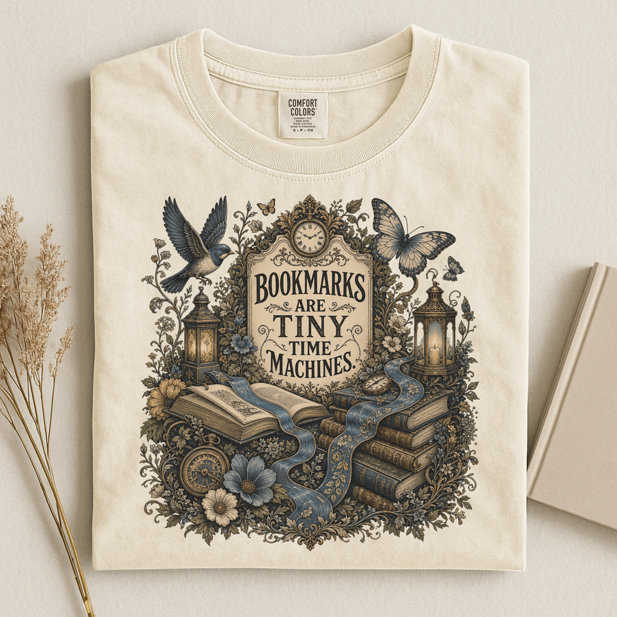 Bookmarks Are Tiny Time Machines bookish tee in Ivory, flat lay