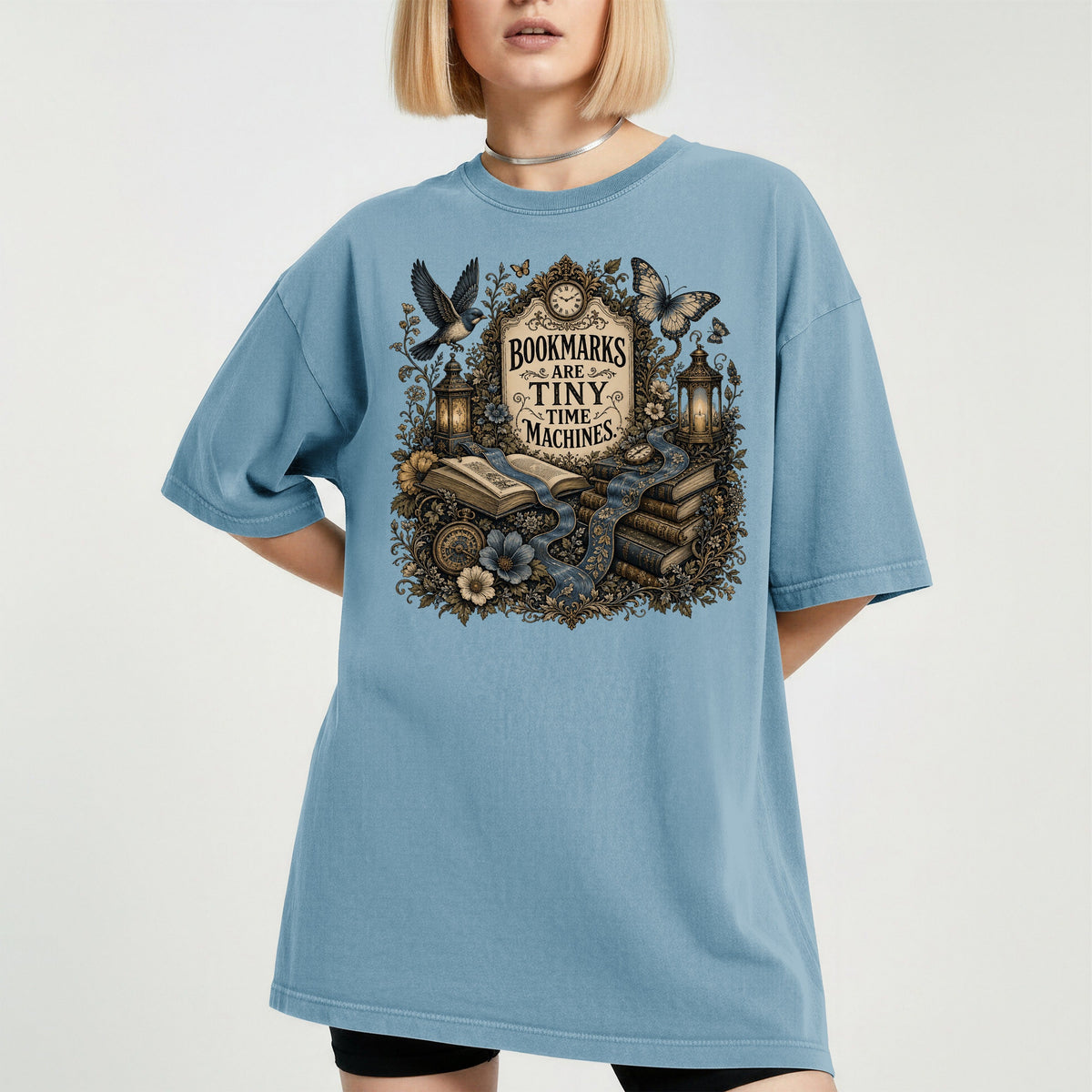 Bookmarks Are Tiny Time Machines bookish tee in Ice Blue, worn