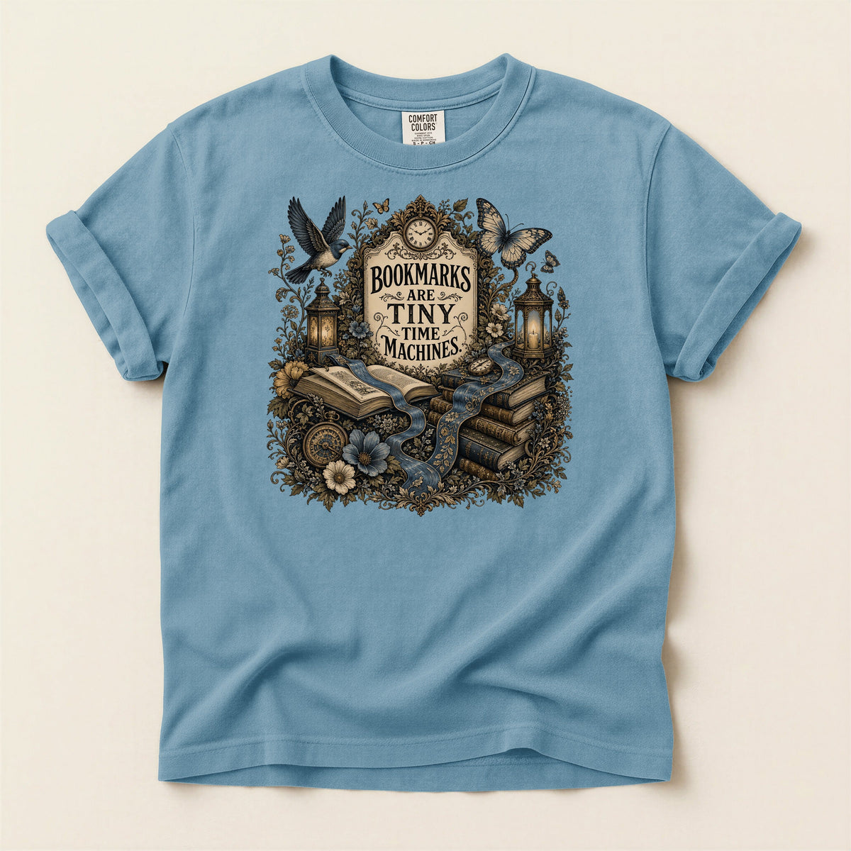 Bookmarks Are Tiny Time Machines bookish tee in Ice Blue, full flat