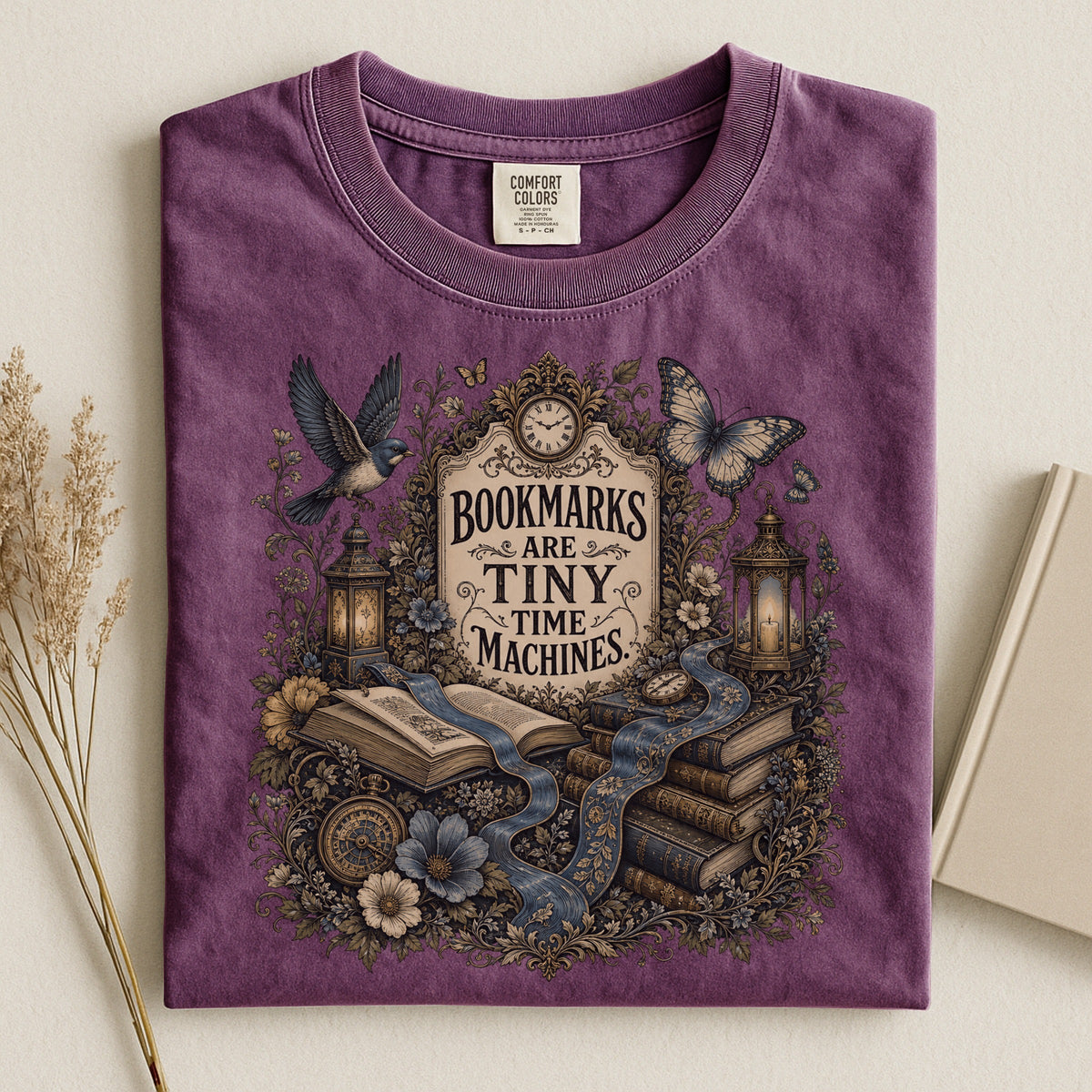 Bookmarks Are Tiny Time Machines bookish tee in Berry, flat lay