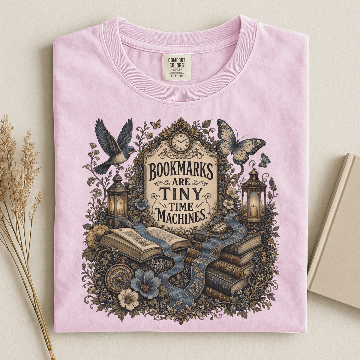Bookmarks Are Tiny Time Machines bookish tee in Blossom, flat lay