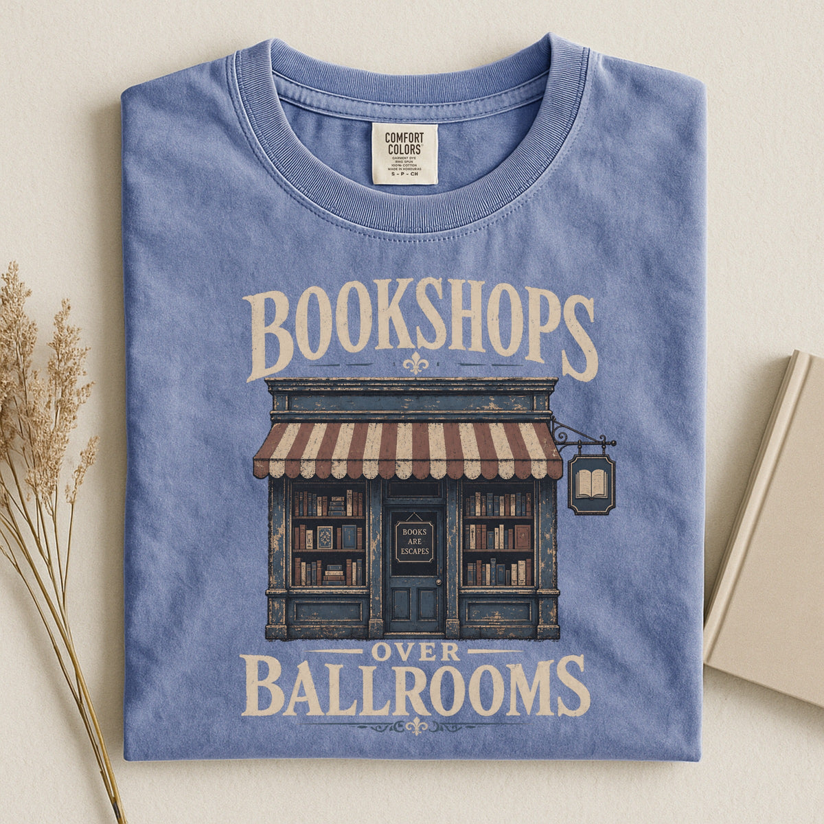 Shelf Love Studio Bookshops Over Ballrooms t-shirt in Blue Jean, styled flat lay