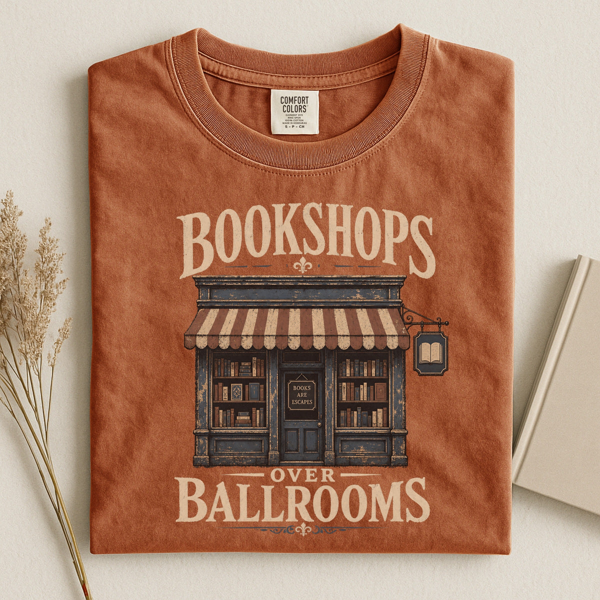 Shelf Love Studio Bookshops Over Ballrooms t-shirt in Yam, styled flat lay