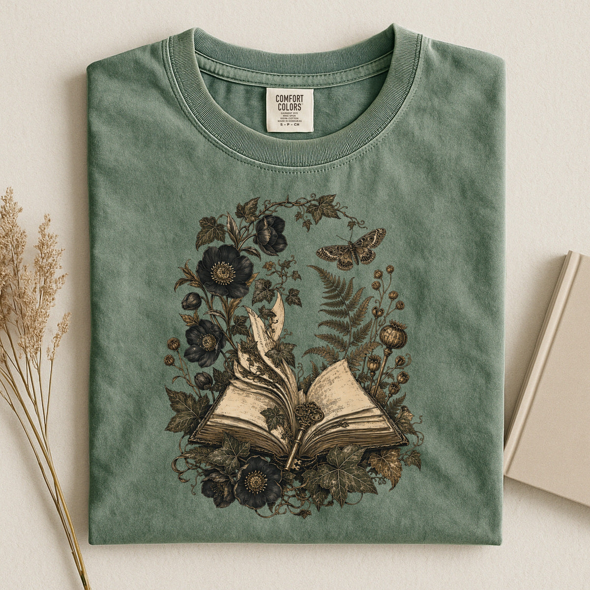 Shelf Love Studio Botanical Open Book t-shirt in Moss, styled flat lay