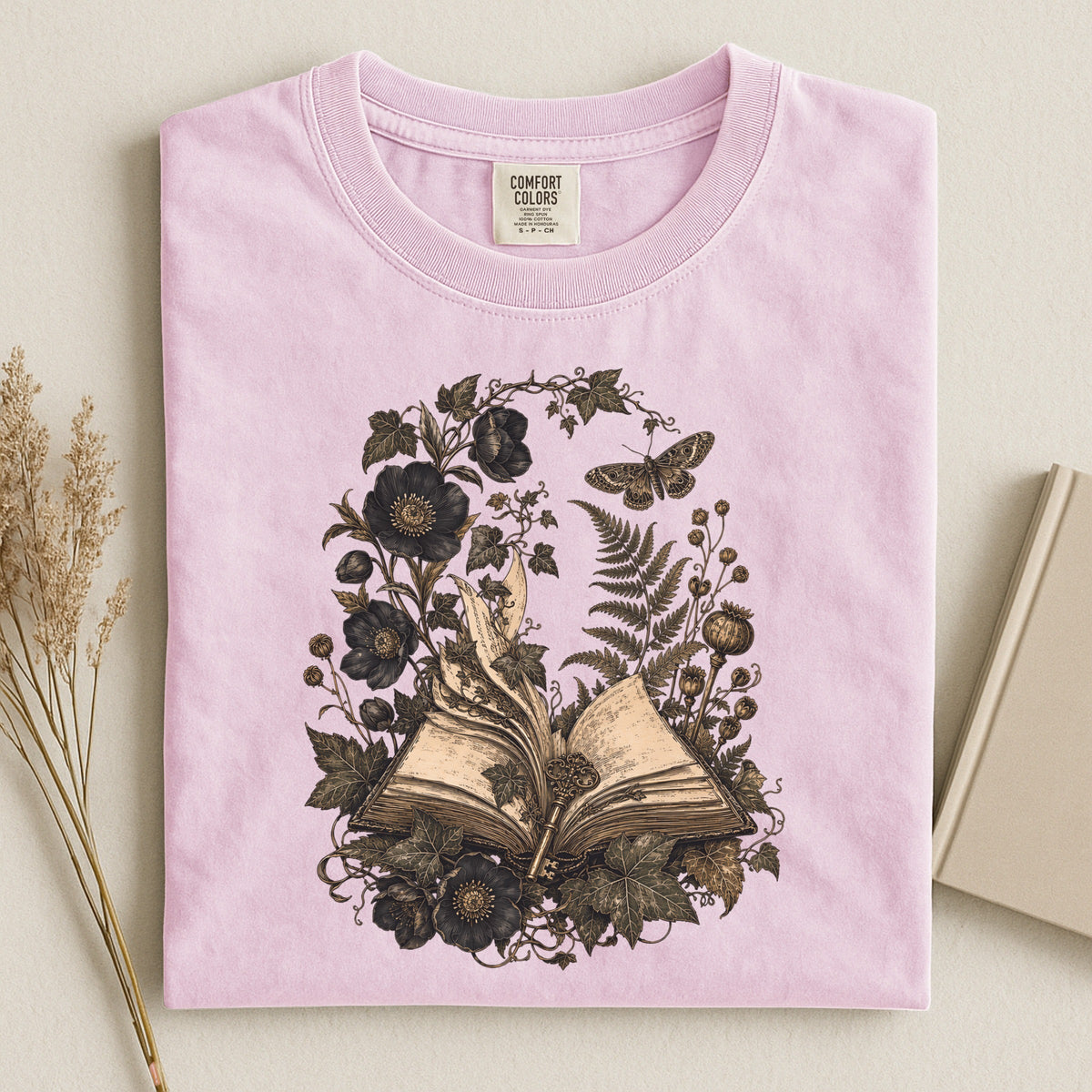 Shelf Love Studio Botanical Open Book t-shirt in Blossom, styled flat lay