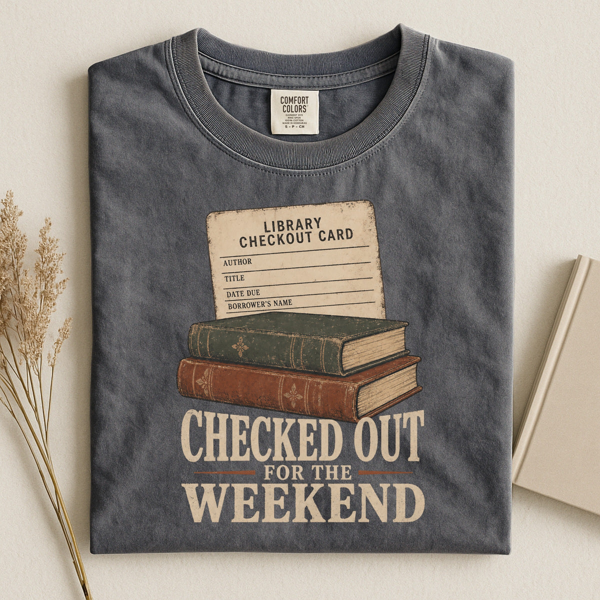 Shelf Love Studio Checked Out for the Weekend t-shirt in Pepper, styled flat lay