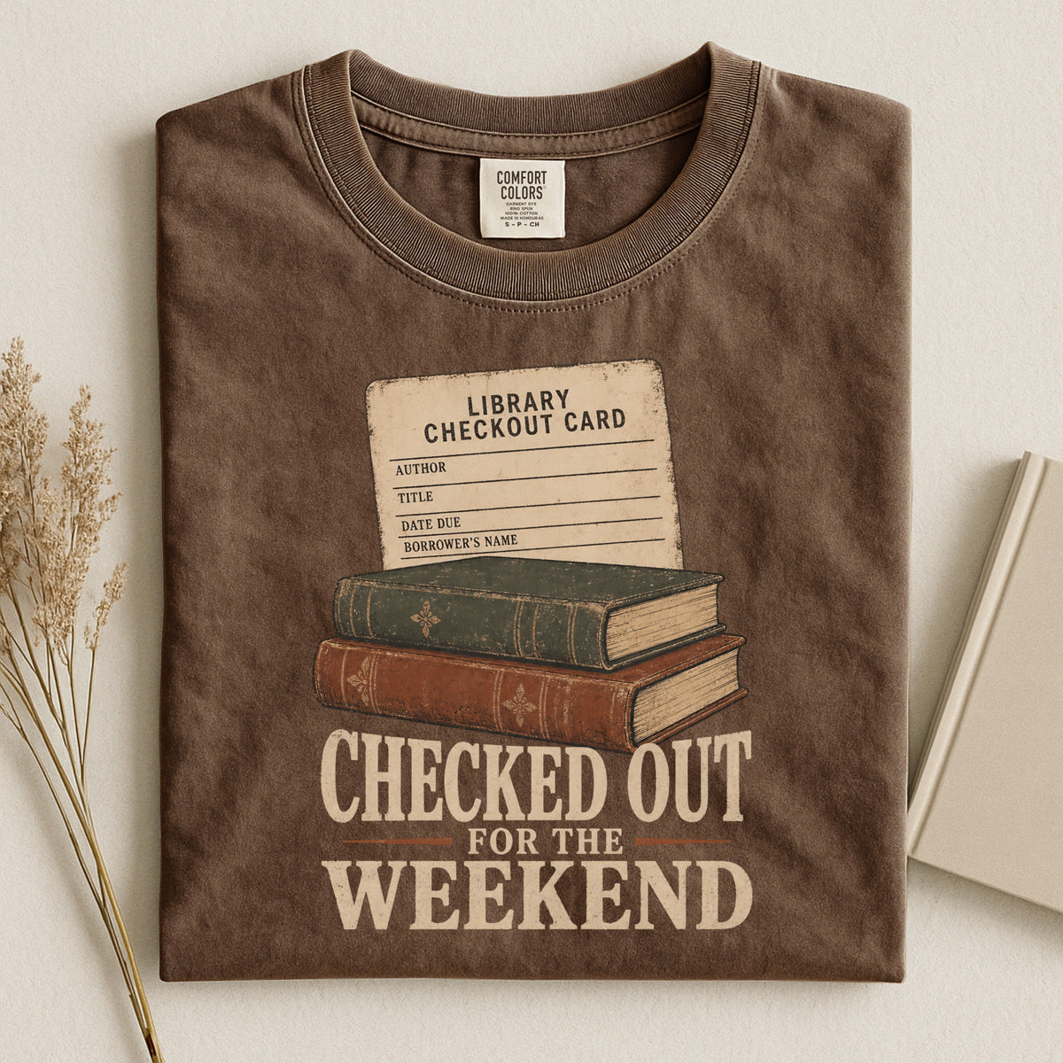 Shelf Love Studio Checked Out for the Weekend t-shirt in Espresso, styled flat lay