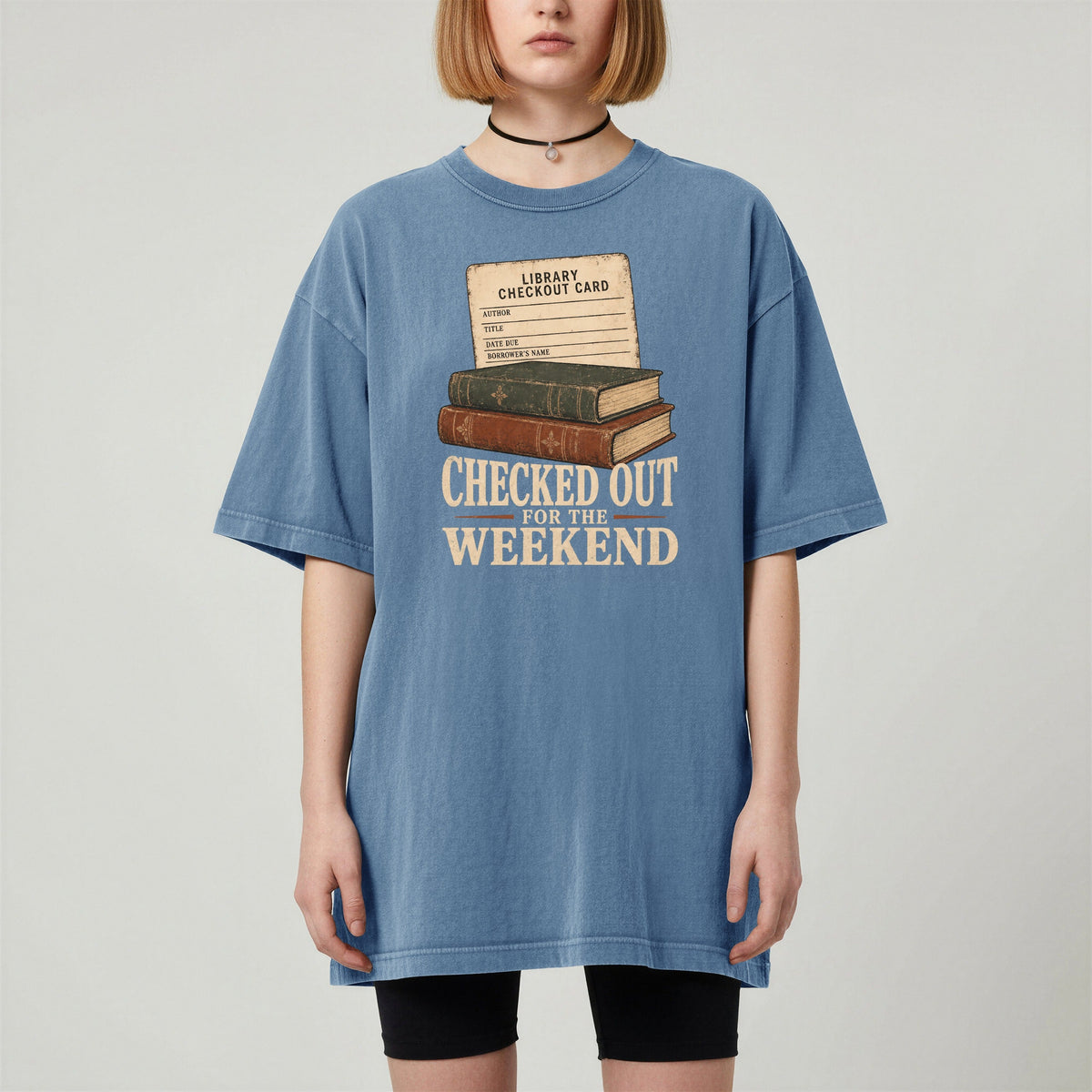 Shelf Love Studio Checked Out for the Weekend t-shirt in Blue Jean, worn