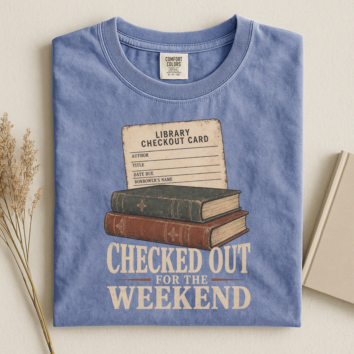 Shelf Love Studio Checked Out for the Weekend t-shirt in Blue Jean, styled flat lay
