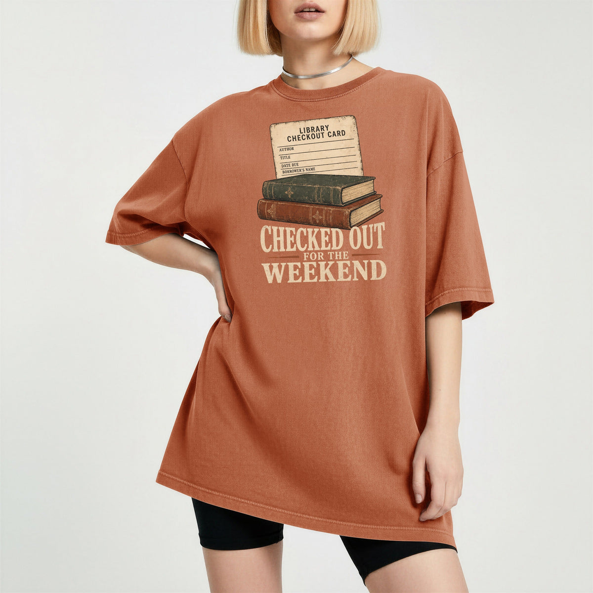Shelf Love Studio Checked Out for the Weekend t-shirt in Yam, worn