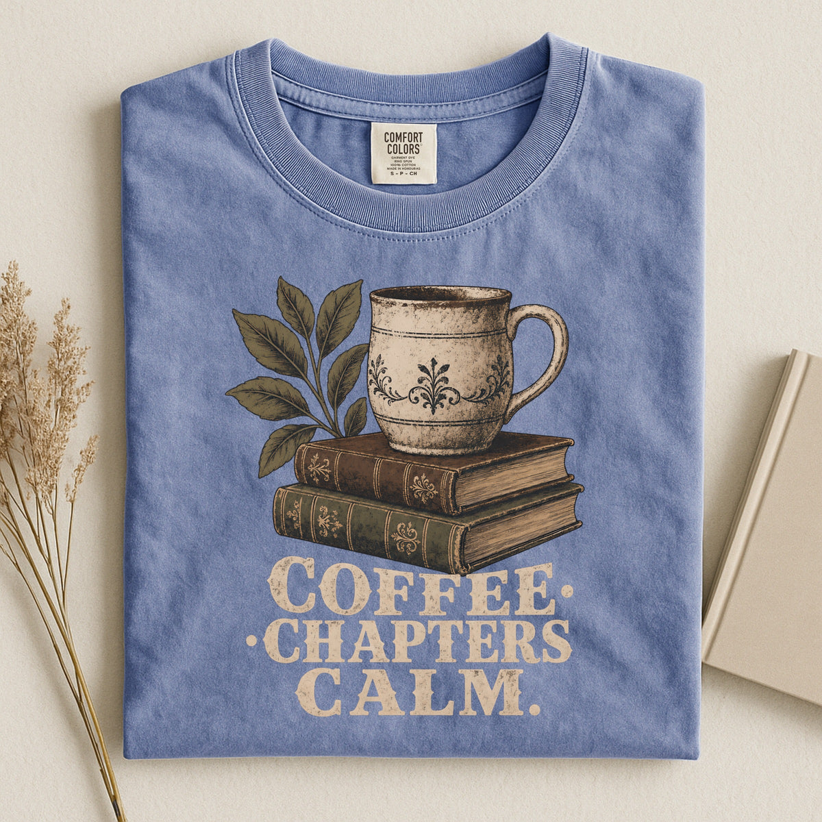Shelf Love Studio Coffee. Chapters. Calm. t-shirt in Blue Jean, styled flat lay