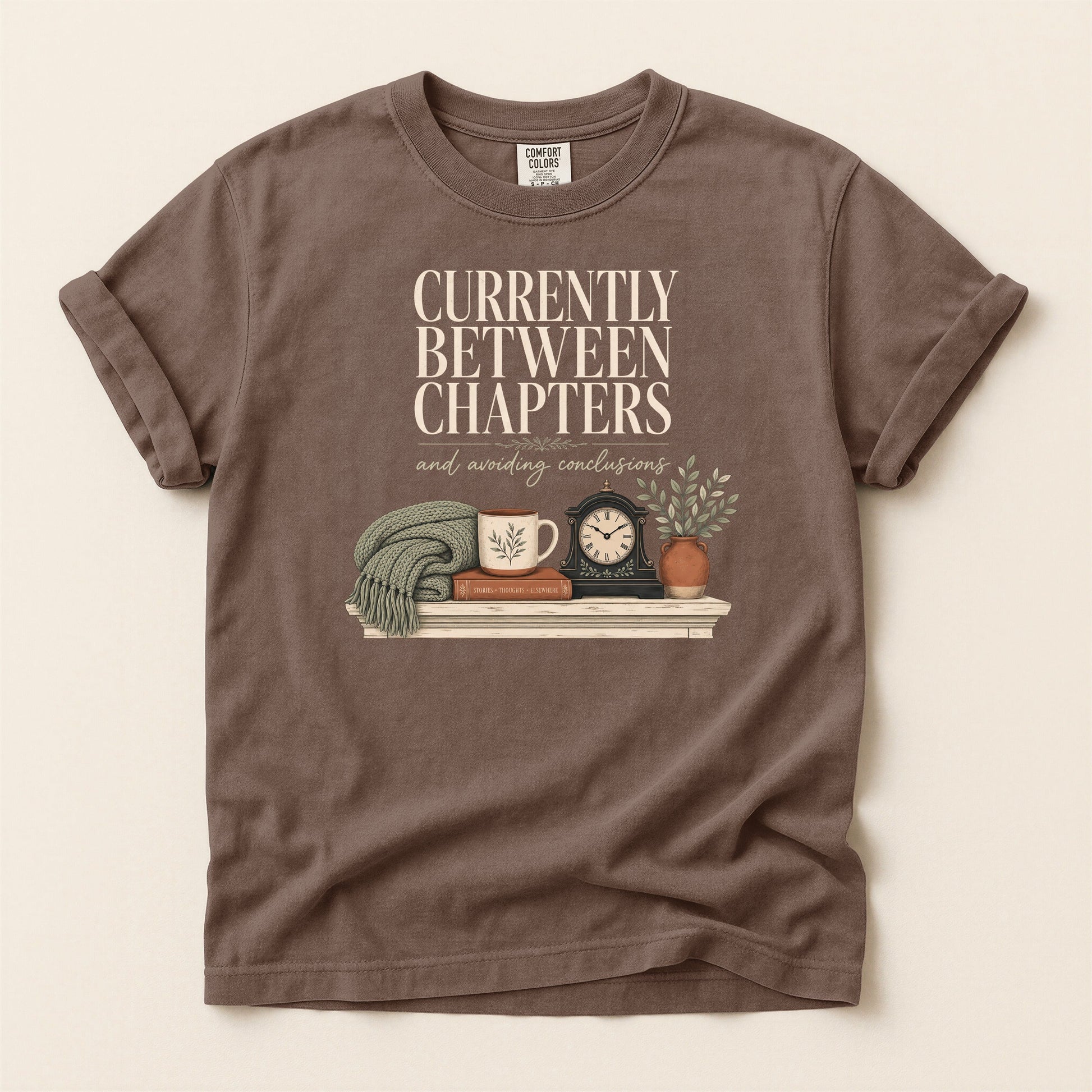 Currently Between Chapters bookish tee in Espresso, full flat