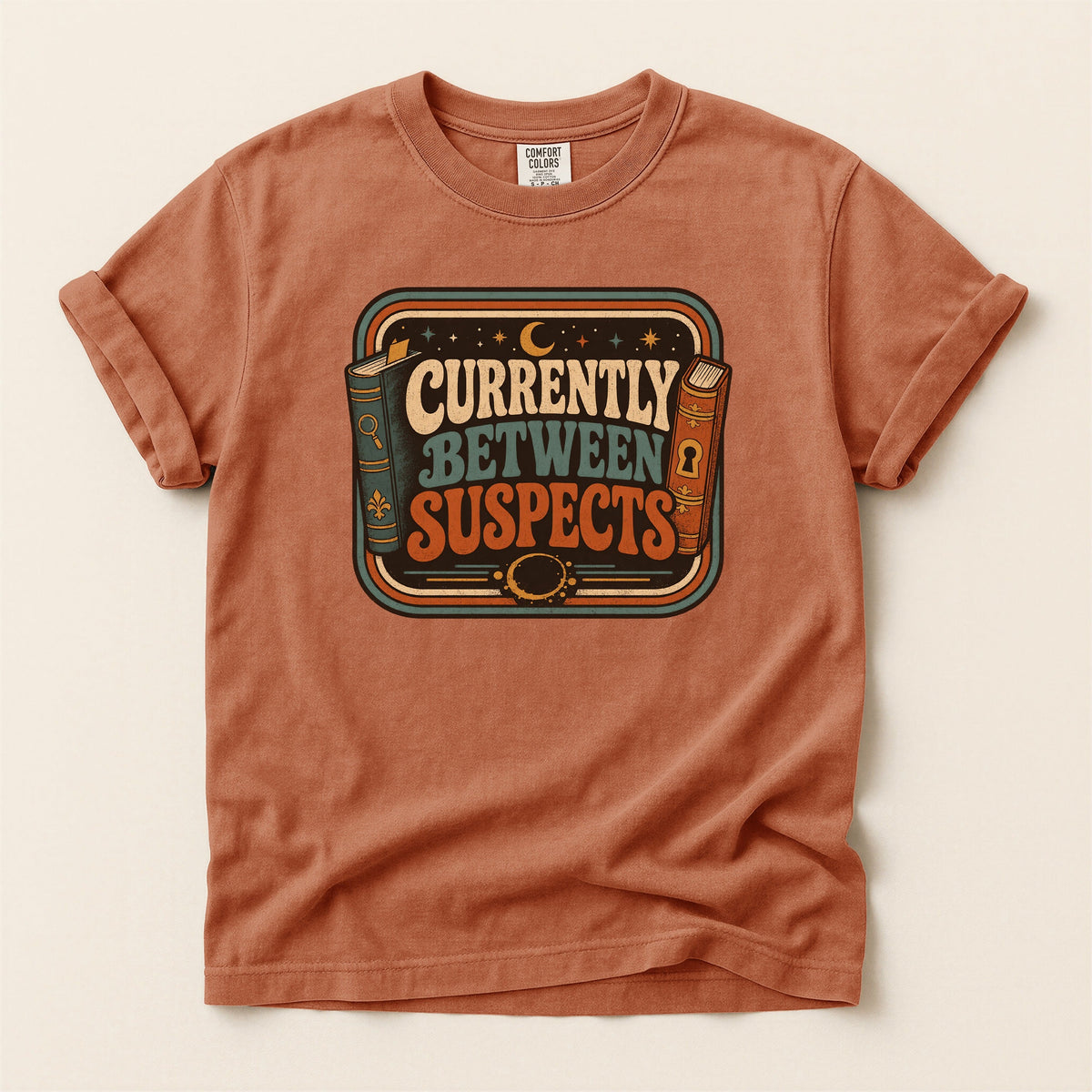 Shelf Love Studio Currently Between Suspects t-shirt in Yam, flat