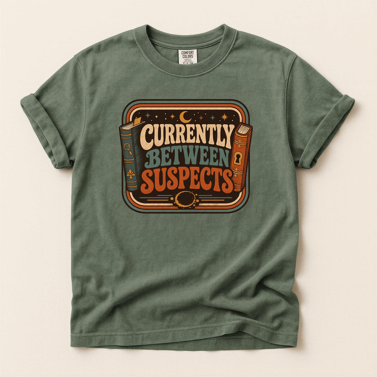 Shelf Love Studio Currently Between Suspects t-shirt in Moss, flat