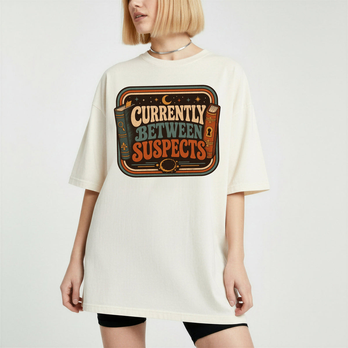 Shelf Love Studio Currently Between Suspects t-shirt in Ivory, worn