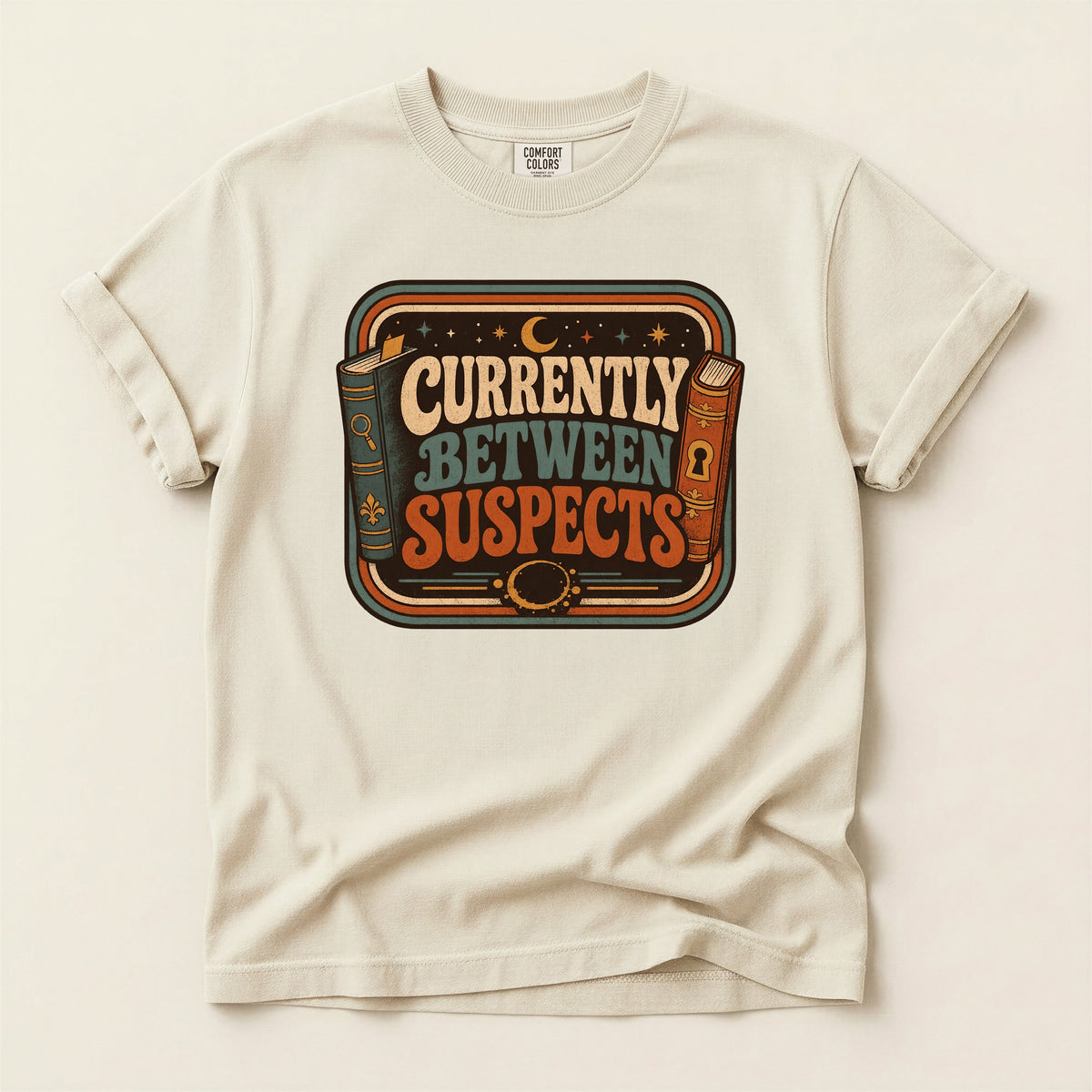Shelf Love Studio Currently Between Suspects t-shirt in Ivory, flat