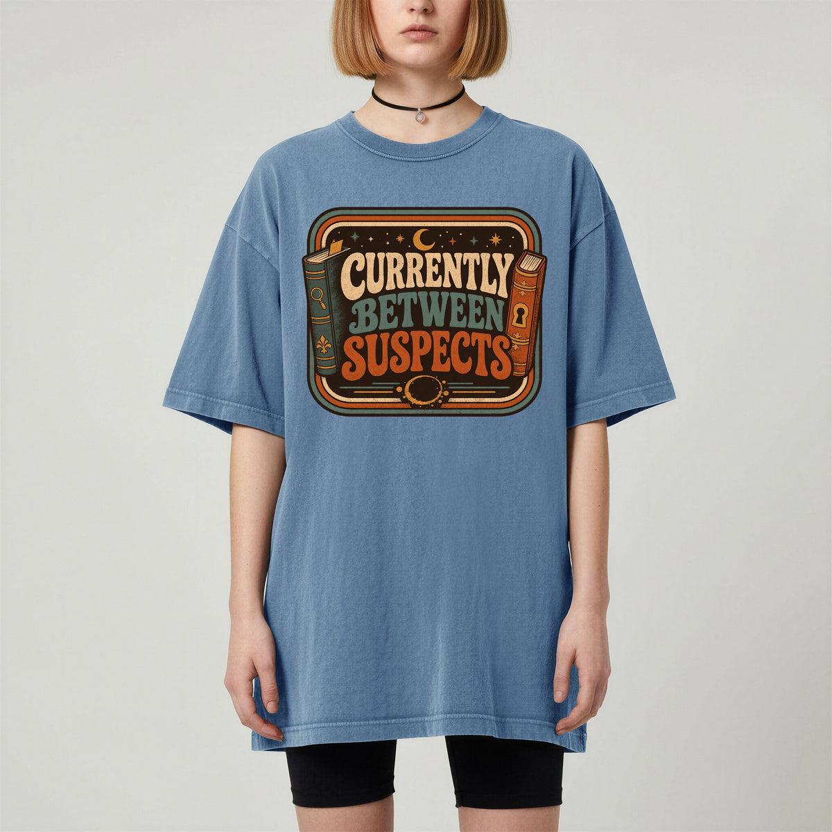Shelf Love Studio Currently Between Suspects t-shirt in Blue Jean, worn