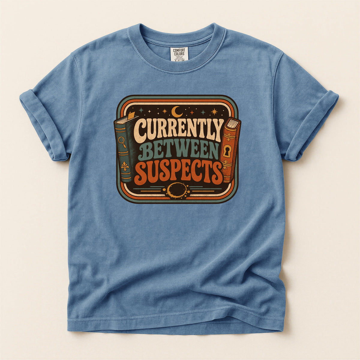 Shelf Love Studio Currently Between Suspects t-shirt in Blue Jean, flat