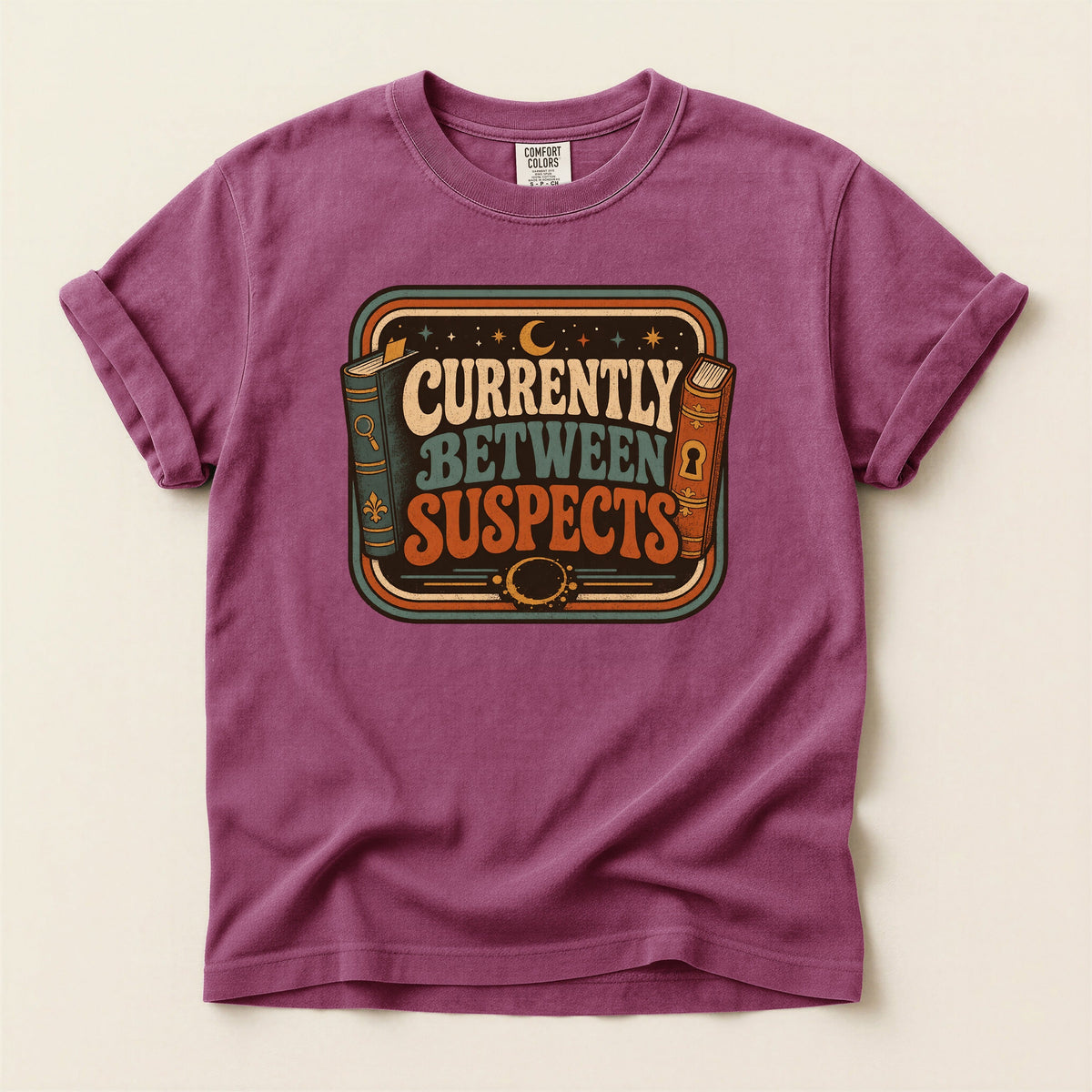 Shelf Love Studio Currently Between Suspects t-shirt in Berry, flat