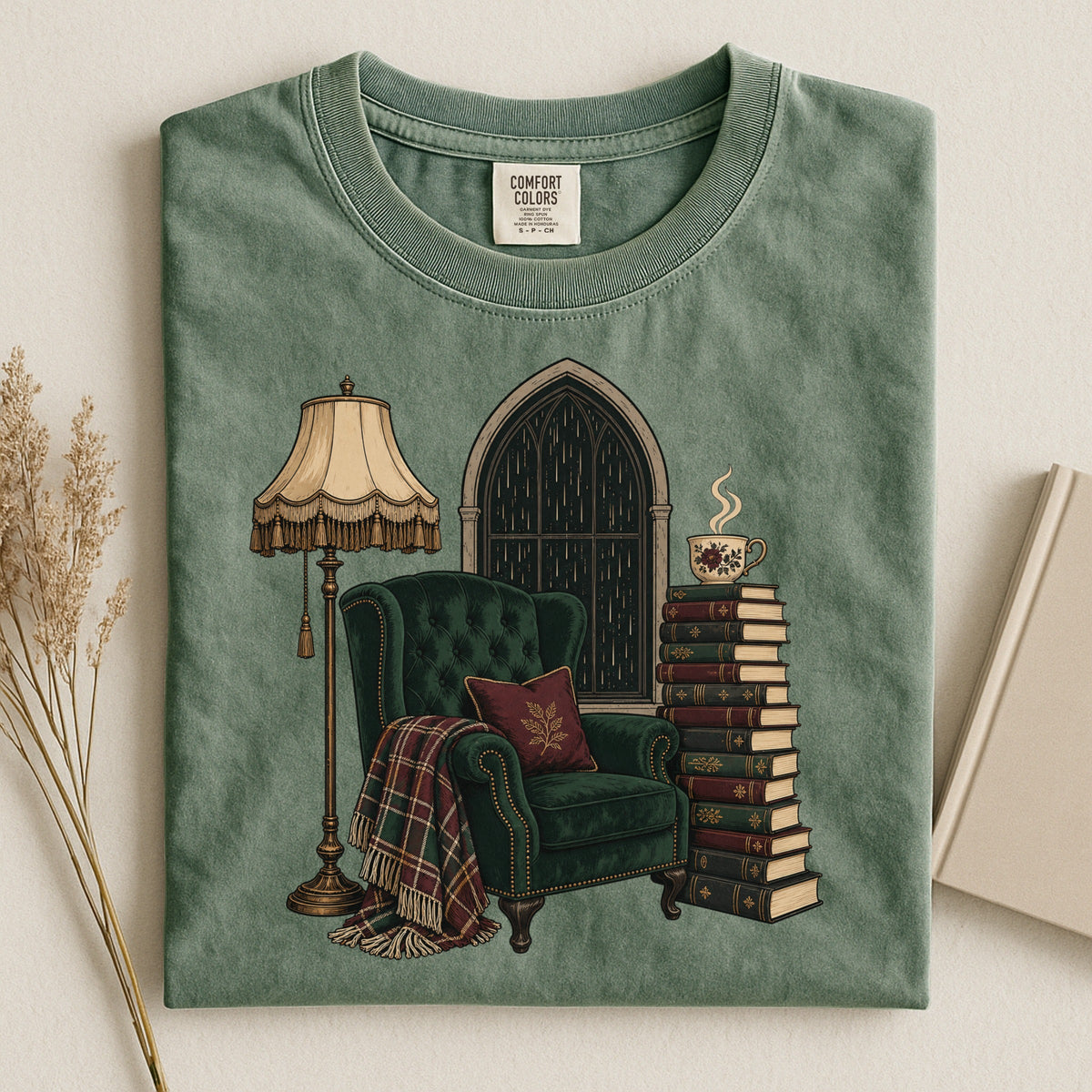 Shelf Love Studio Dark Academia Reading Chair t-shirt in Moss, styled flat lay