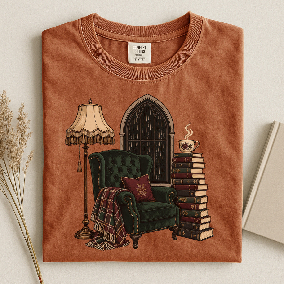 Shelf Love Studio Dark Academia Reading Chair t-shirt in Yam, styled flat lay
