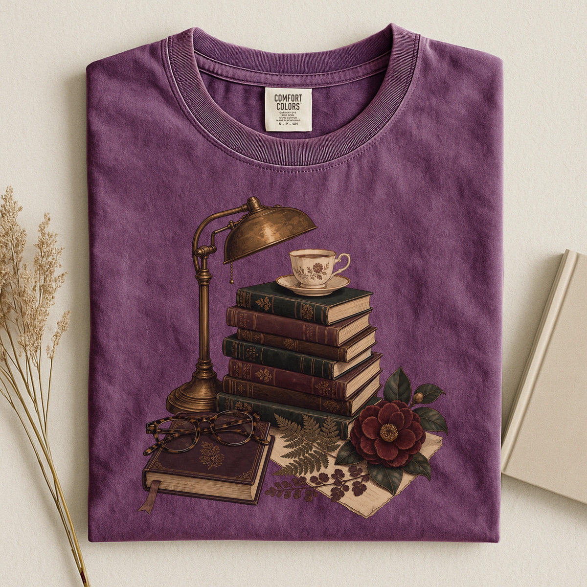 Shelf Love Studio Dark Academia Reading Lamp t-shirt in Berry, styled flat lay