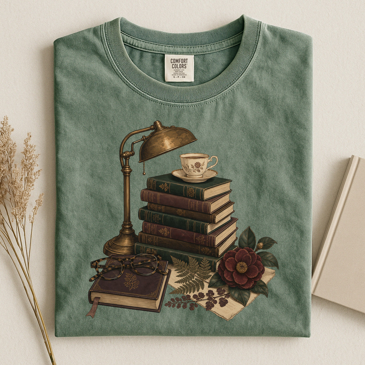 Shelf Love Studio Dark Academia Reading Lamp t-shirt in Moss, styled flat lay
