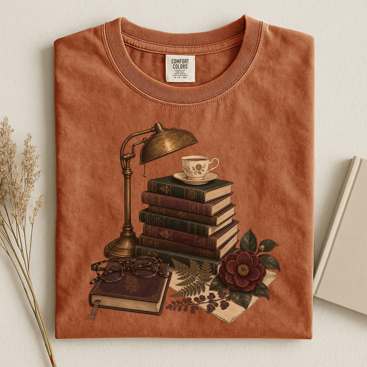 Shelf Love Studio Dark Academia Reading Lamp t-shirt in Yam, styled flat lay