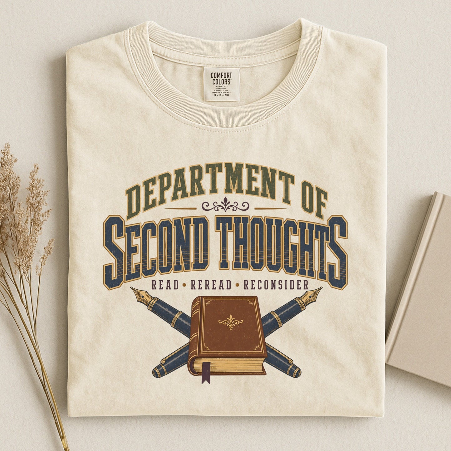 Department of Second Thoughts bookish tee in Ivory, flat lay