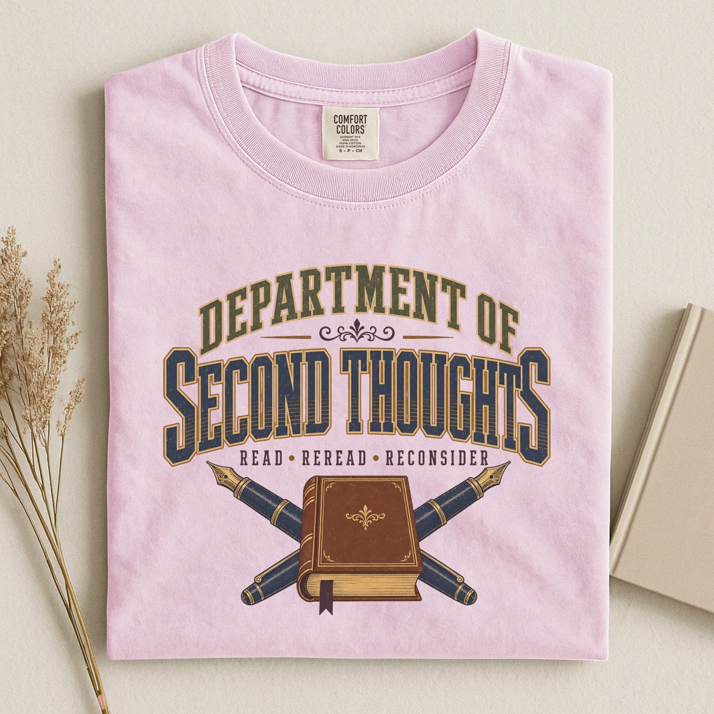Department of Second Thoughts bookish tee in Blossom, flat lay