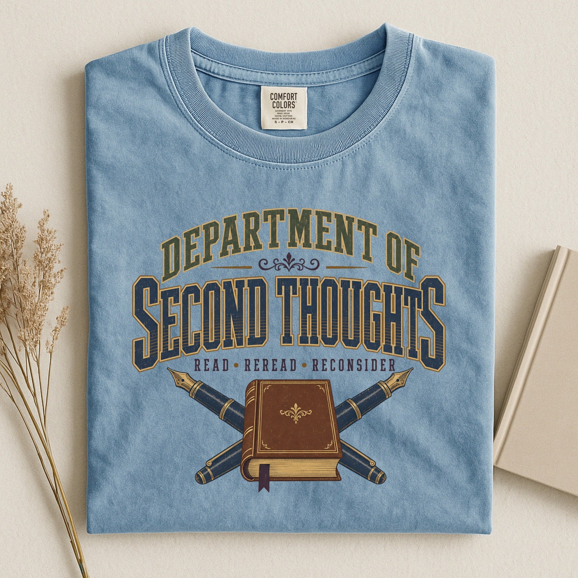 Department of Second Thoughts bookish tee in Ice Blue, flat lay