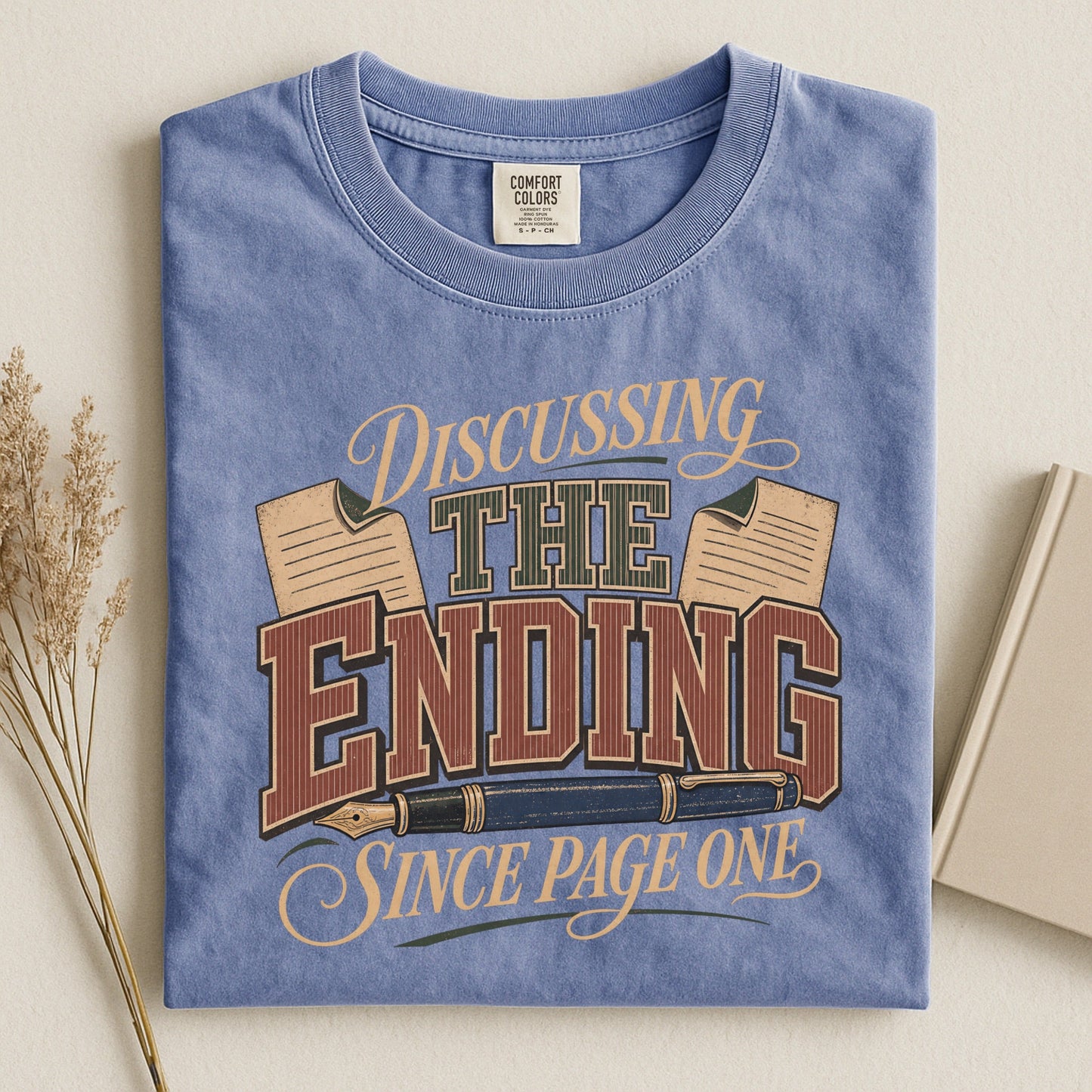 Discussing the Ending Since Page One bookish tee in Blue Jean, flat lay